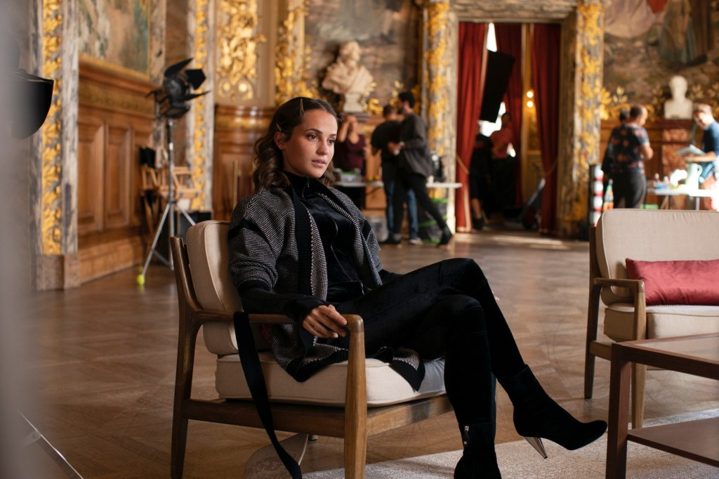 a first look at alicia vikander in olivier assayas s bold new